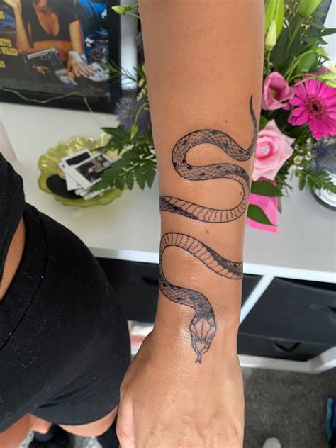 arm snake tattoo|snake wrapped around wrist tattoo.